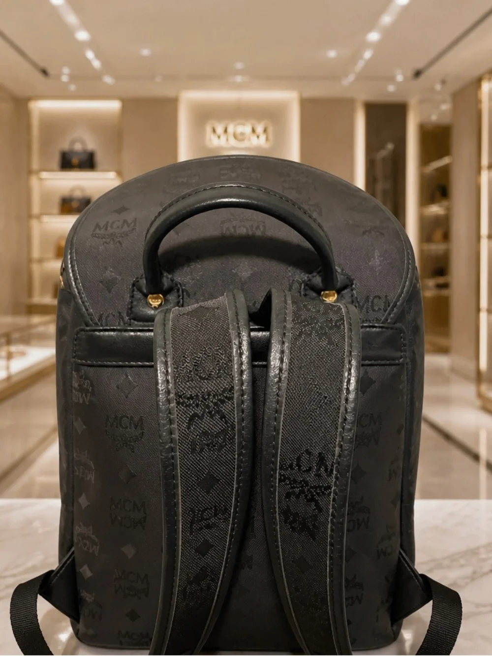 MCM Black Monogram Backpack with Gold-Plated Detail